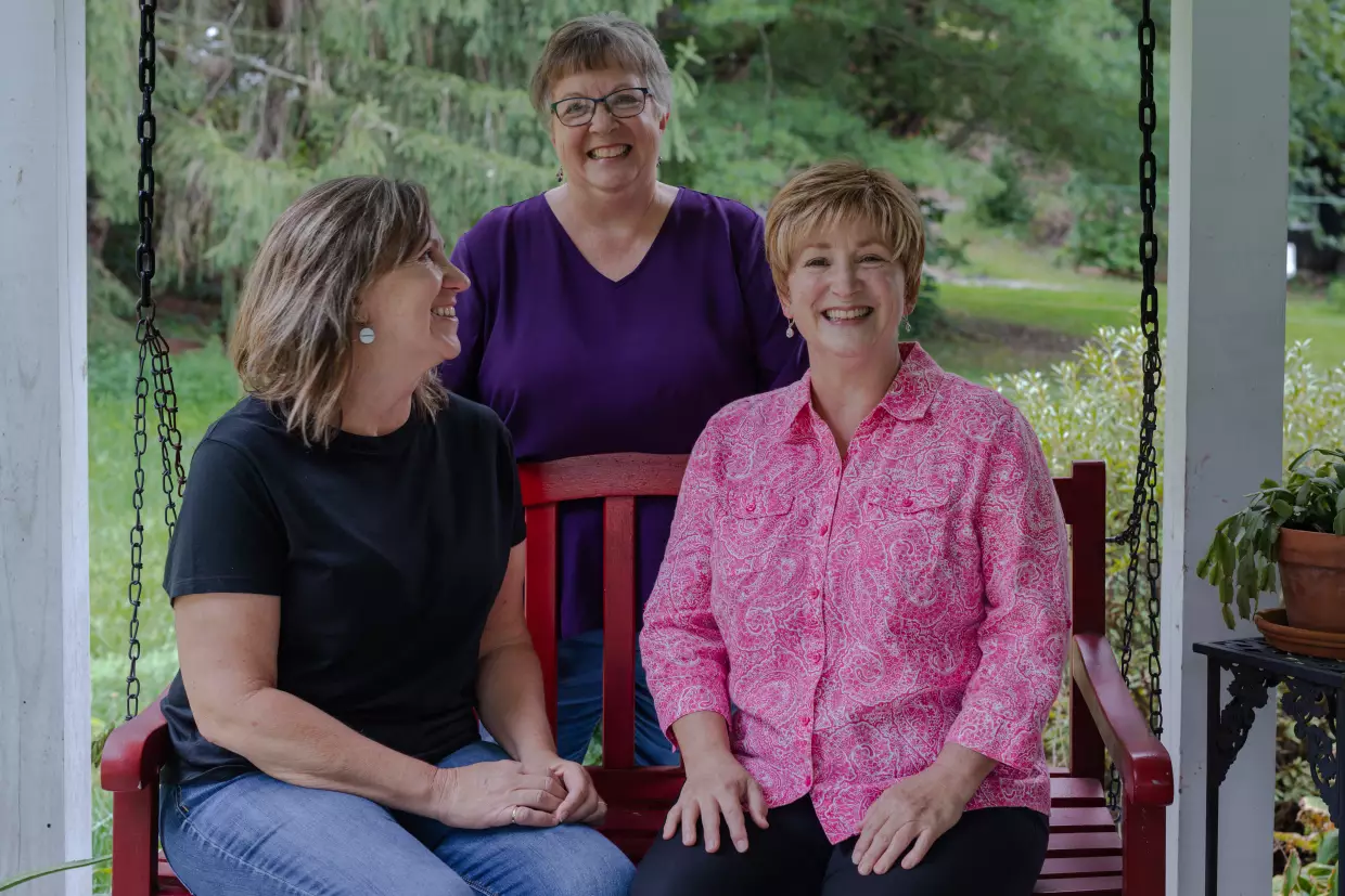 June Ward (right) — pictured with her sisters Susie Gilliam (center) and Karen Douthitt (left) — carries a rare gene mutation that virtually guarantees she will get Alzheimer's in the next few years. She is part of a network of more than 200 families with these kinds of gene mutations who have volunteered as research subjects over the past two decades.