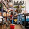 A family gathers food in the community pantry at the Central Texas Food Bank on March 26 in Austin, Texas. The Trump administration's USDA is ending a yearly food insecurity survey.
