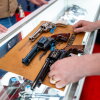 Revolvers are displayed on a countertop during the NRA conference on April 18 in Houston.