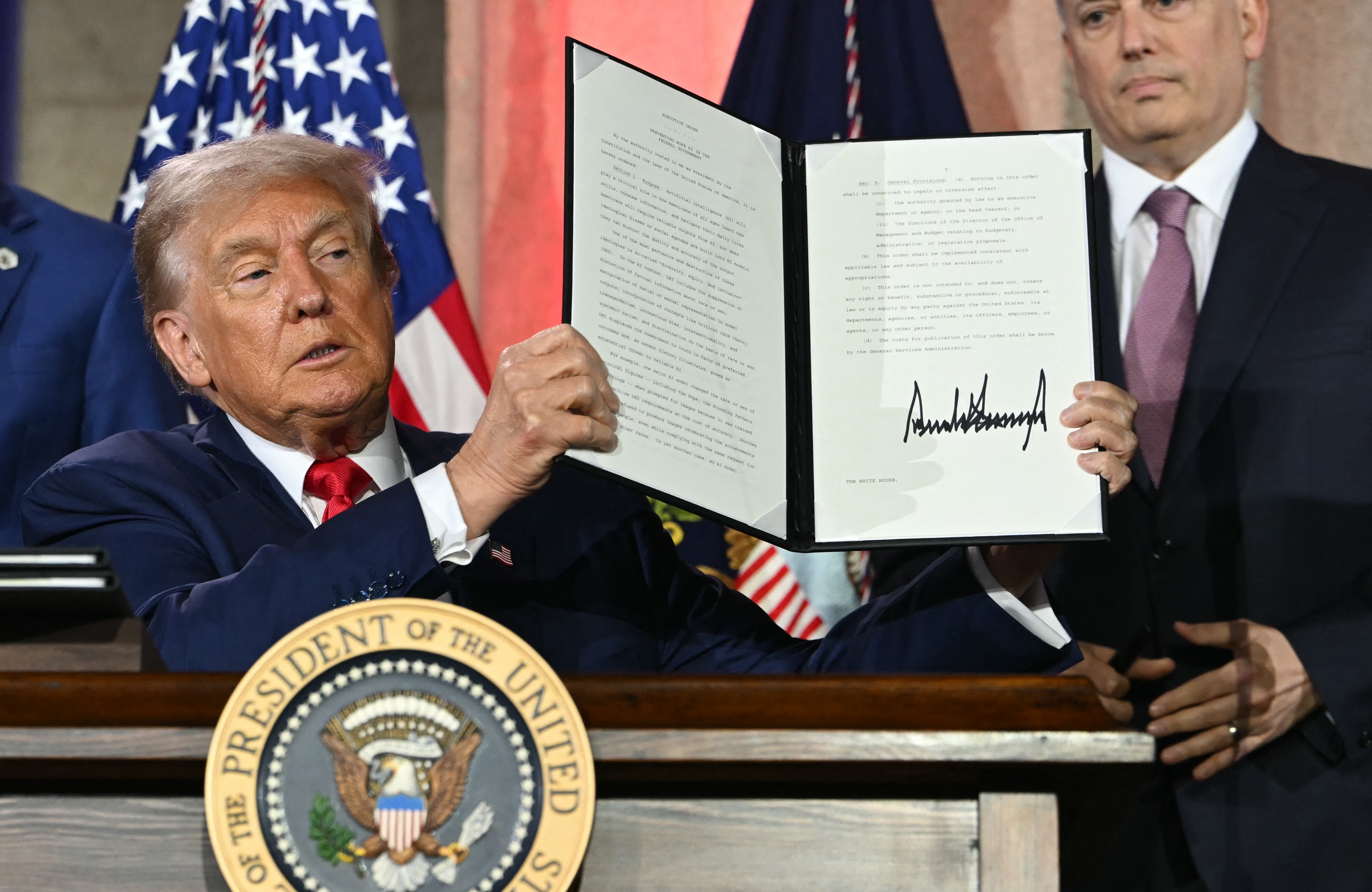 President Trump displays an executive order on artificial intelligence he signed in Washington, DC, on July 23, 2025.