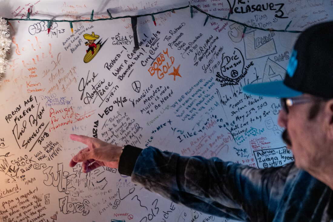 Richard Segovia points to notes musicians have left over the years in his house in San Francisco in April.