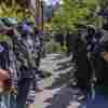 Pro-Palestinian students and activists face police officers after protesters were evicted from the library at Portland State University in Portland, Ore., in May.