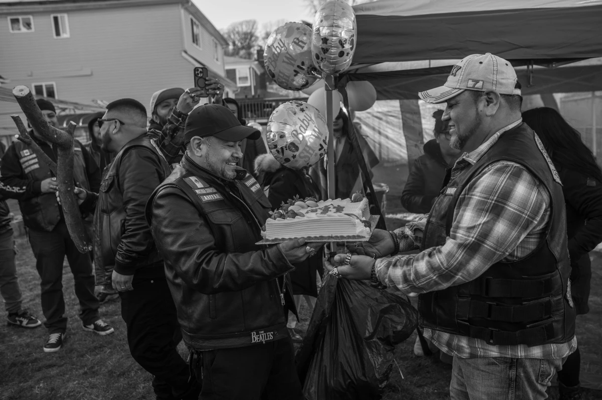 Alfredo Ramirez, known as 'Mad Max,' receives a birthday cake during a party in Staten Island.