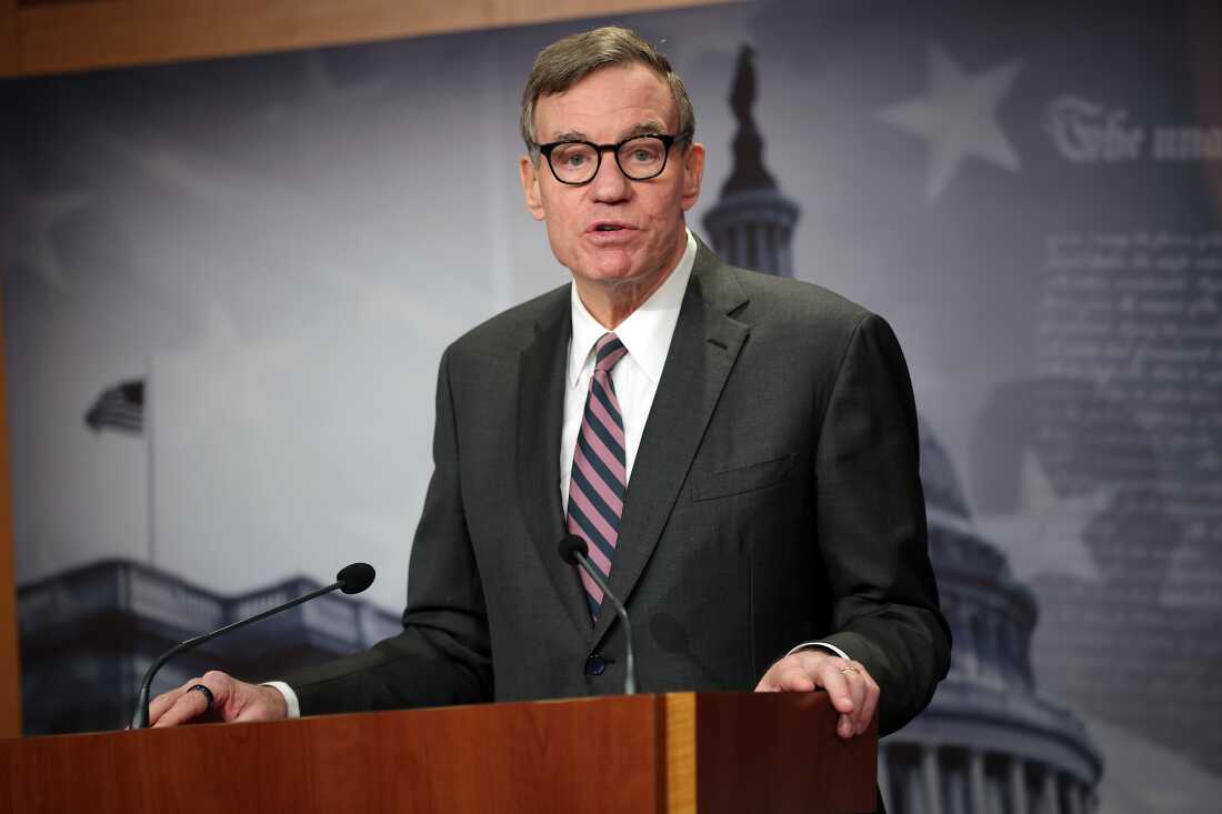 Sen. Mark Warner, D-Va., speaks at a news conference at the U.S. Capitol on Feb. 3 in Washington. Warner called on Tulsi Gabbard to testify in person after raising concerns about her presence at an FBI raid on a Georgia election office related to the 2020 election.