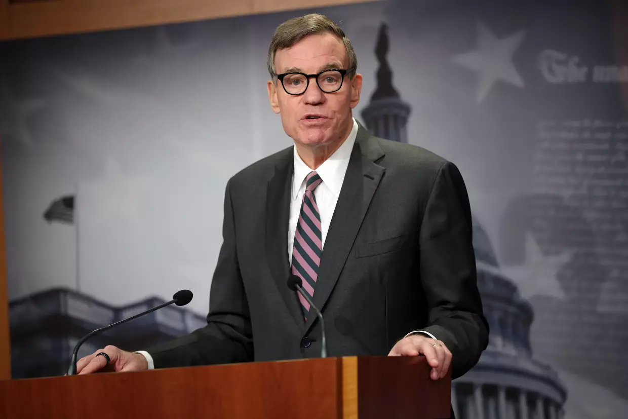 Sen. Mark Warner, D-Va., speaks at a news conference at the U.S. Capitol on Feb. 3 in Washington. Warner called on Tulsi Gabbard to testify in person after raising concerns about her presence at an FBI raid on a Georgia election office related to the 2020 election.