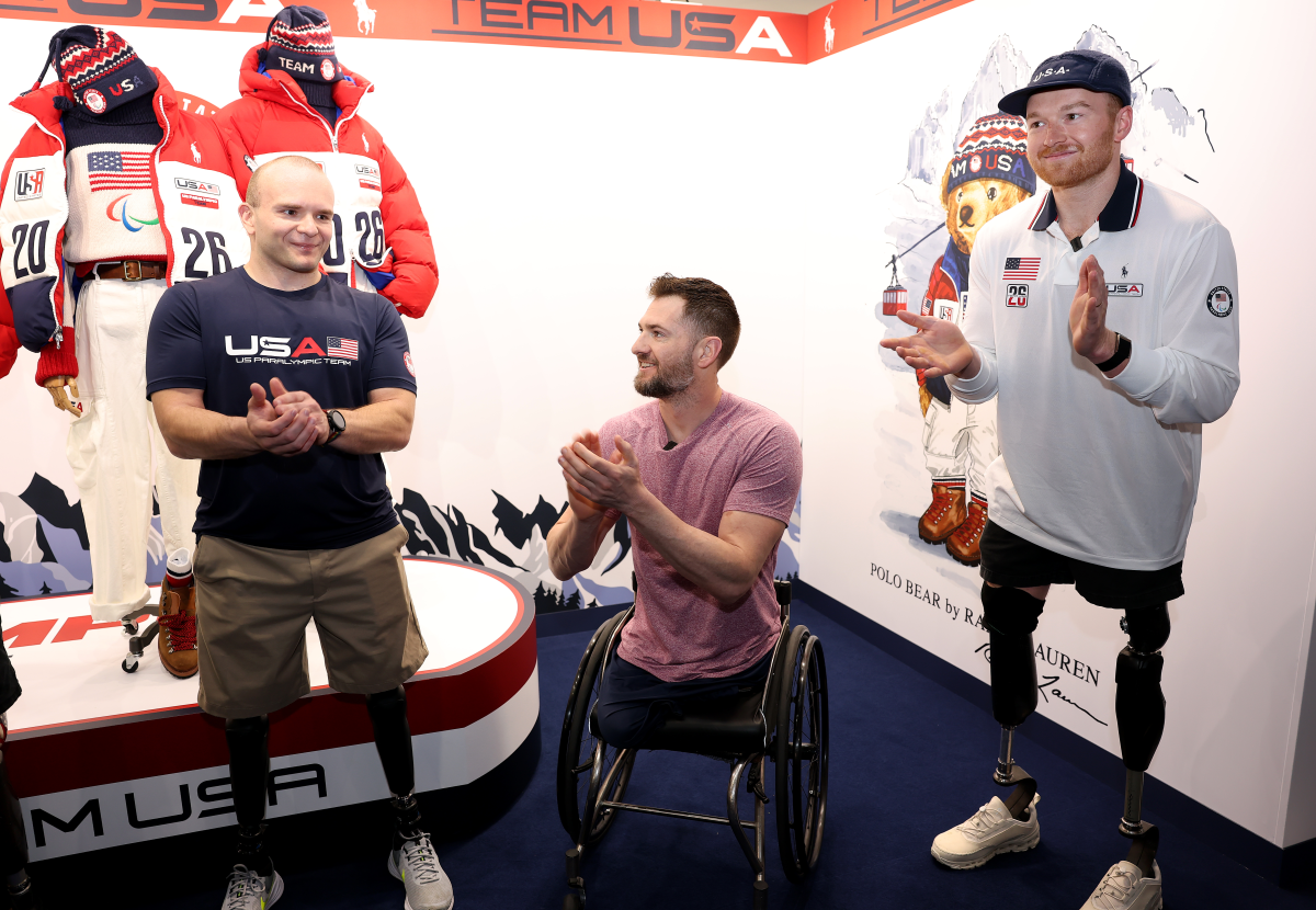 Para sled hockey athlete Josh Pauls, seen with teammates Kevin Dodson and Declan Farmer, reacts to being named one of Team USA's opening ceremony flagbearers in late February in Italy.