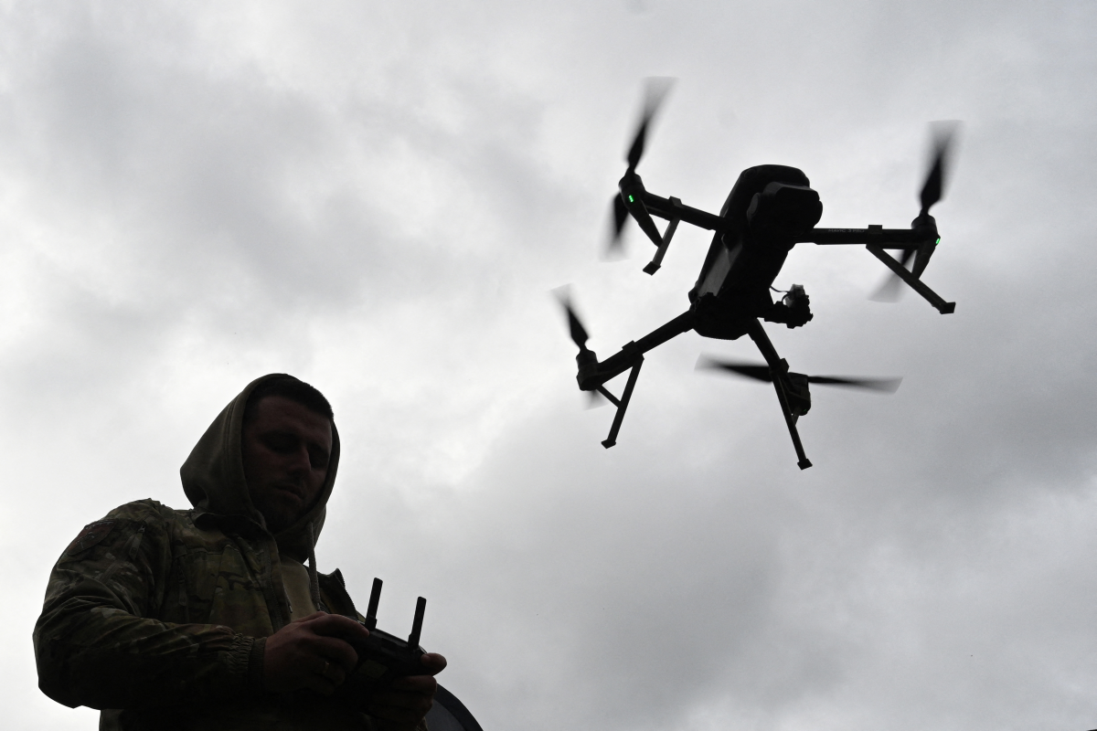 A Ukrainian serviceman operates a drone during a racing competition, which simulates combat conditions, in Kamianets-Podilskyi, Khmelnytskyi region, on Oct. 5, 2025, amid the Russian invasion of Ukraine.