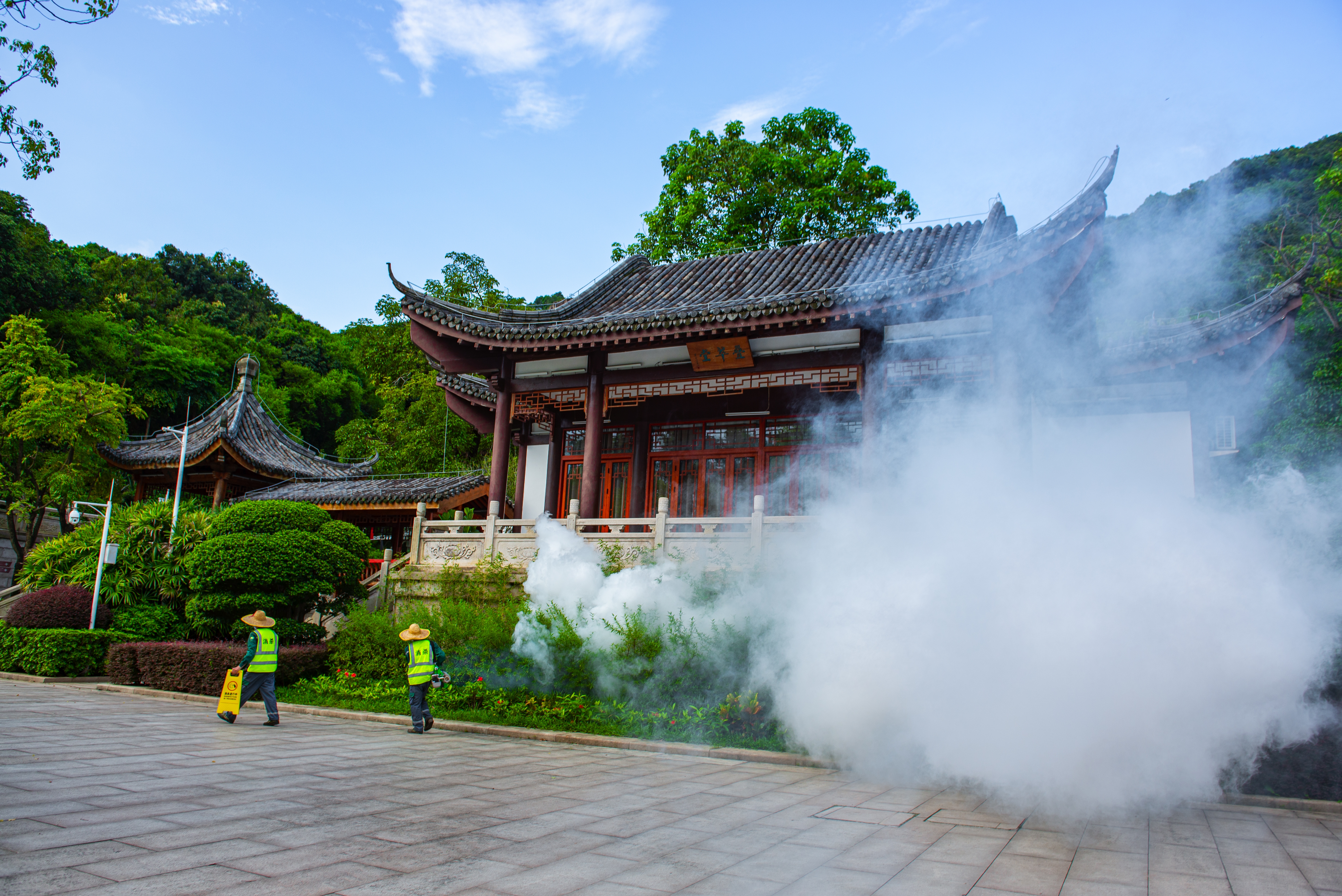 A worker uses a sprayer to eradicate mosquitos at a park in order to prevent the spread of mosquito-borne disease Chikungunya in Guangdong Province of China.
