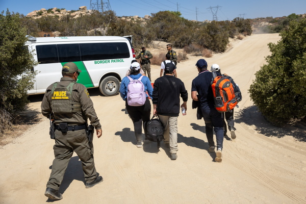 U.S. Border Patrol agents take asylum-seekers into custody after they crossed a remote area of the U.S.-Mexico border near Jacumba Hot Springs, Calif., on Sept. 19.