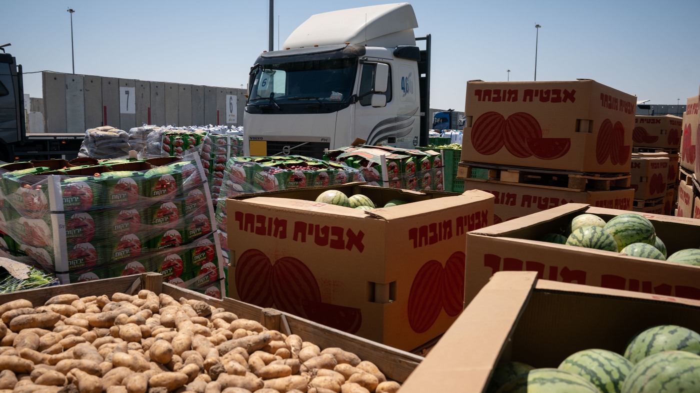 Food aid piles up in Gaza. Here's why it's not reaching those in need : NPR
