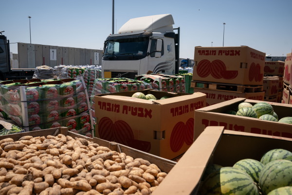 Food and water is stacked and prepared to be loaded on trucks from The Israeli border crossing Kerem Shalom to the Gaza strip on July 10.