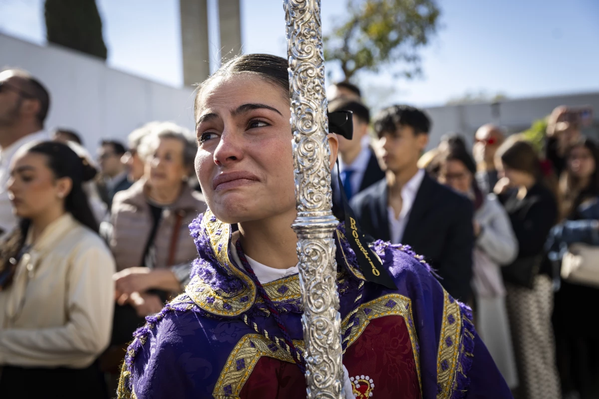 A female member of the group Cautivo y Rescatado cries as she begins her procession to the Cathedral of Seville on March 30.