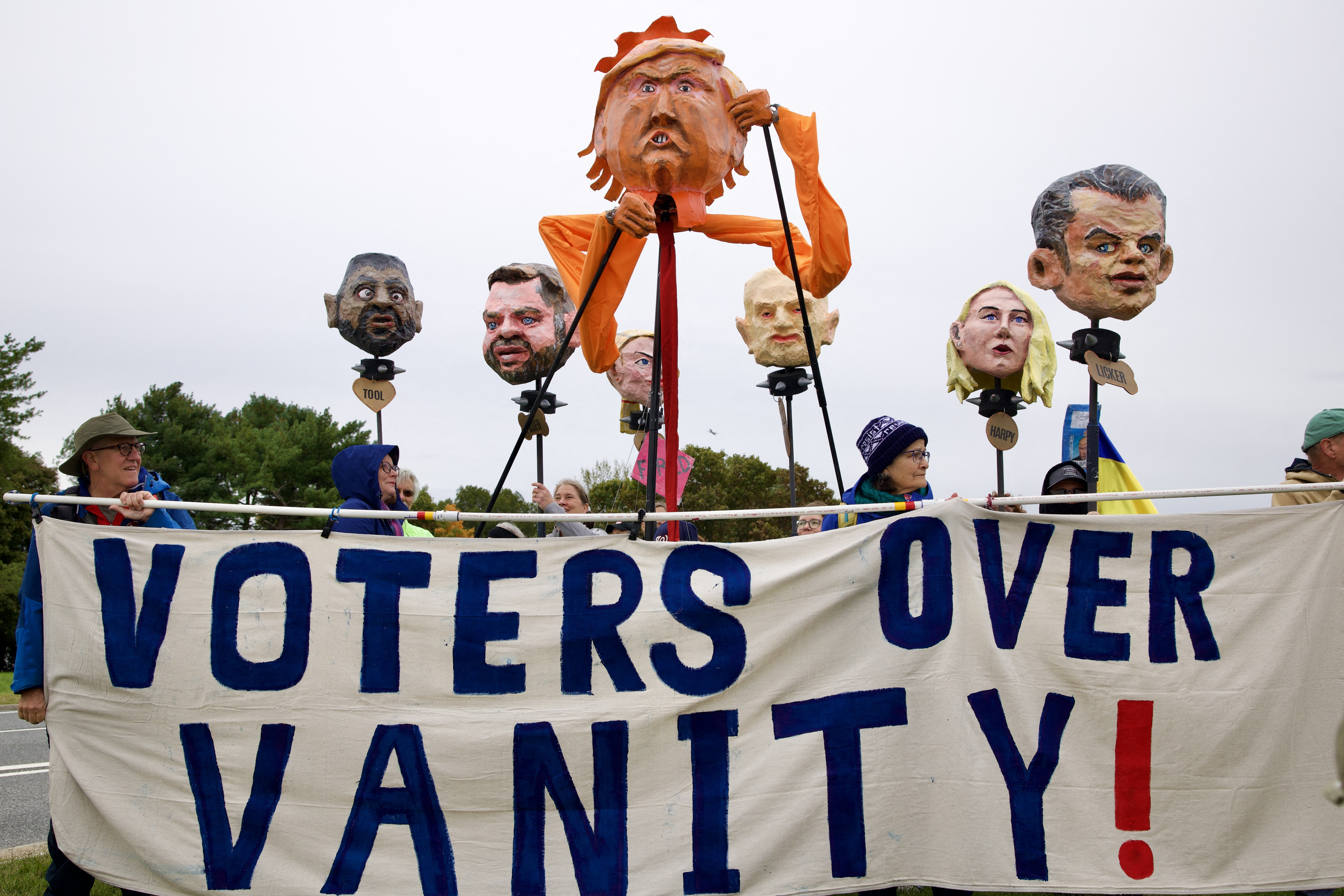 Demonstrators take part in a "No Kings: Vote Early" rally near Memorial Circle in Arlington, Virginia, on Oct. 17. The national day of action is taking place in cities across the country focusing on voter turnout, early voting and election protection, ahead of the midterm elections.