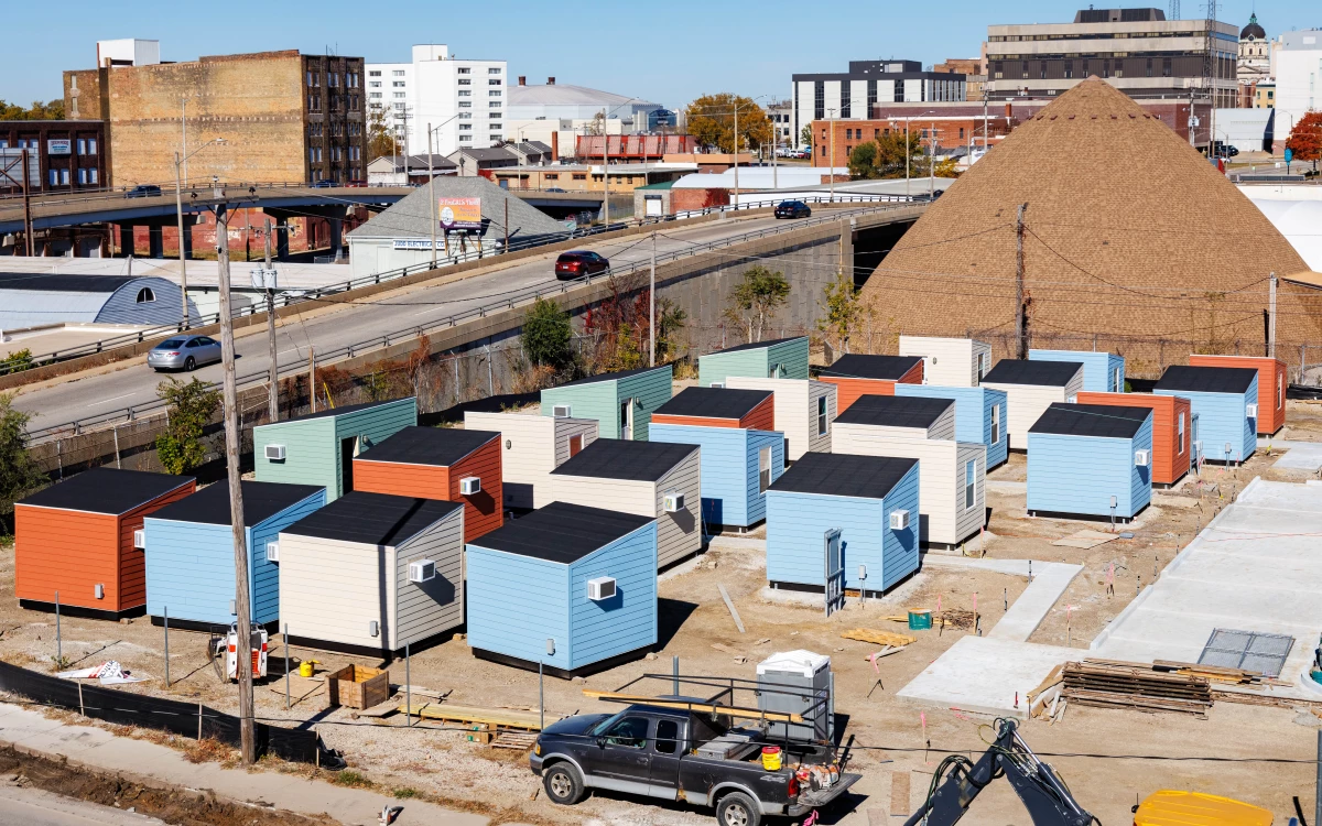Tiny, colorful cabins make up Home Sweet Home Ministries' shelter village, The Bridge, in Bloomington, Illinois. Construction began in the summer of 2025.