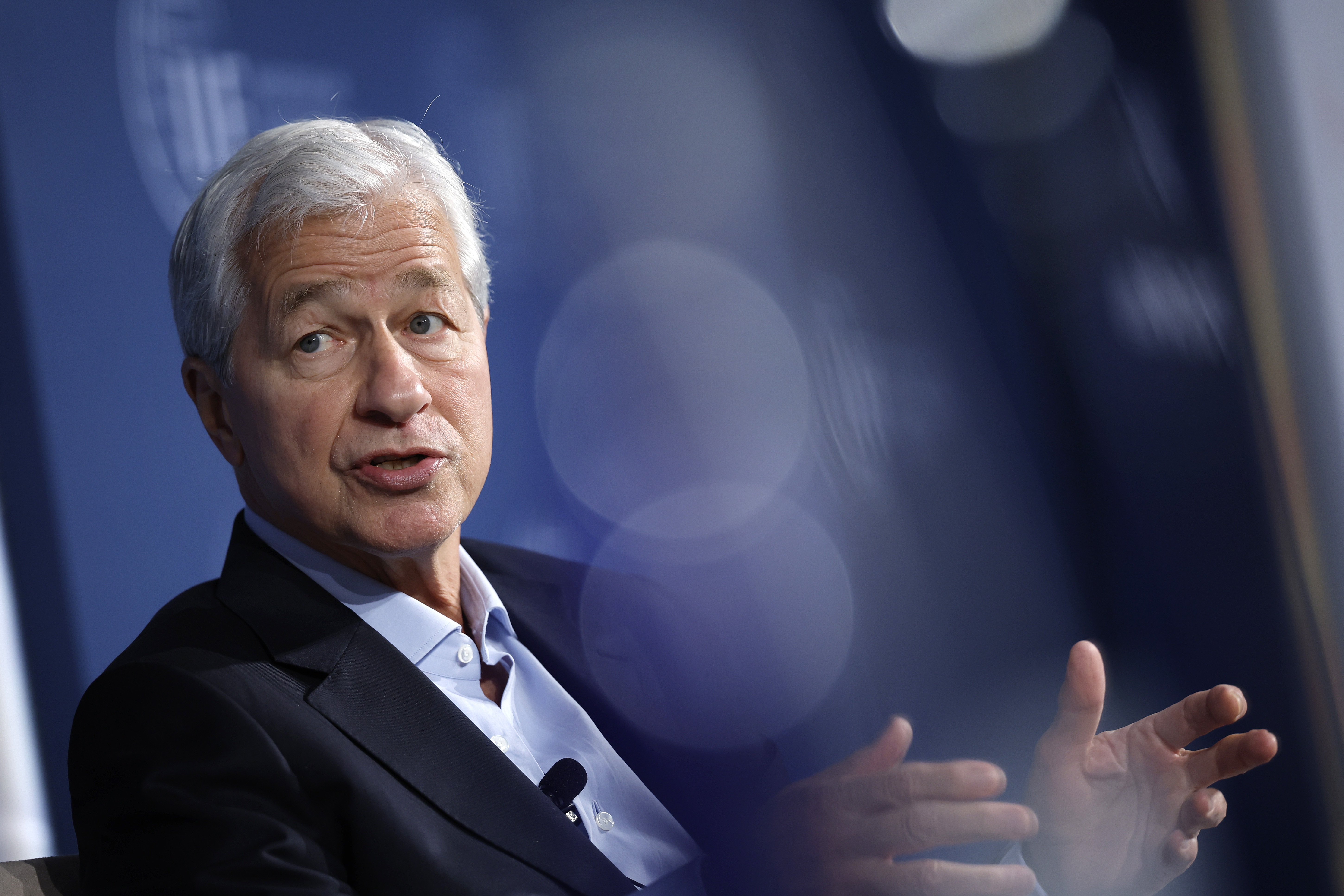 JPMorgan Chase CEO Jamie Dimon, pictured at a meeting in October, warned Monday that tariffs will raise prices, slow economic growth and hurt the country
