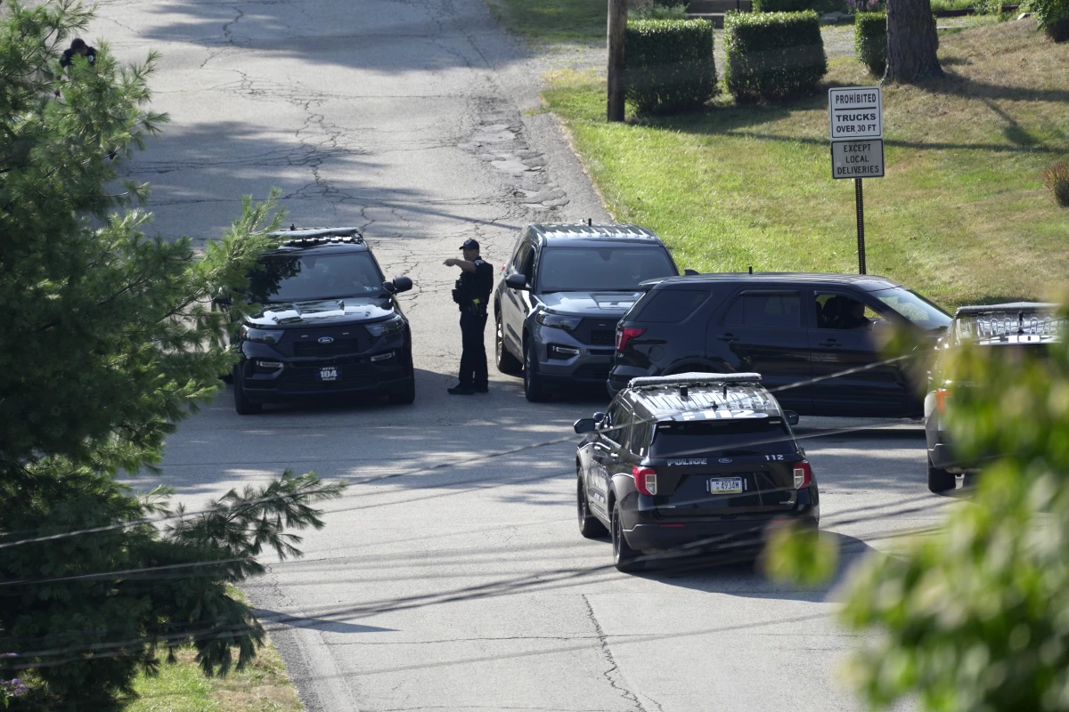 Law enforcement block a street in Bethel Park, Pa., that they say was a residence of Thomas Matthew Crooks, the suspected shooter of former President Donald Trump, on Sunday.