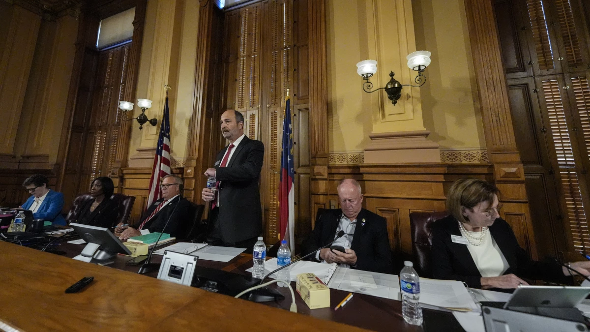 Georgia's State Election Board members meet to discuss proposals for election rule changes at the state capitol in Atlanta Friday.