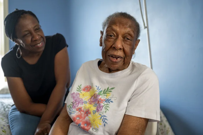 Cookie Jones, left, quit her job to provide care to her mother who has Alzheimer