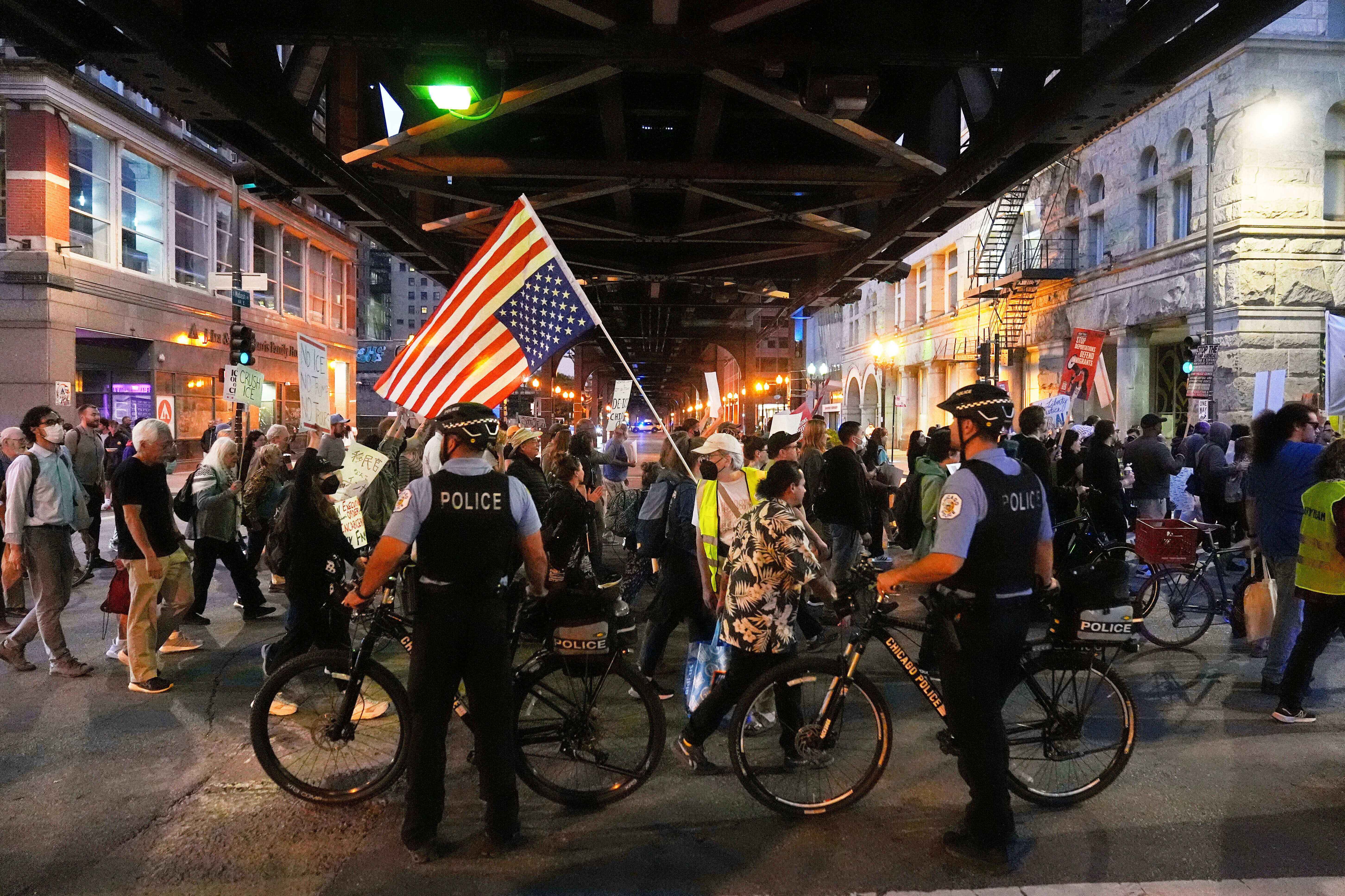 Police officers block a street as demonstrators march at a protest opposing "Operation Midway Blitz" and the presence of ICE, Sept. 9, 2025, in Chicago. (AP)