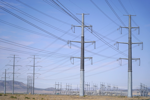 Large electrical transmission lines are routed too Meta's Facebook data center in Eagle Mountain, Utah. The data center is a complex of five large buildings each over four football fields long and totaling 2.4 million square feet.