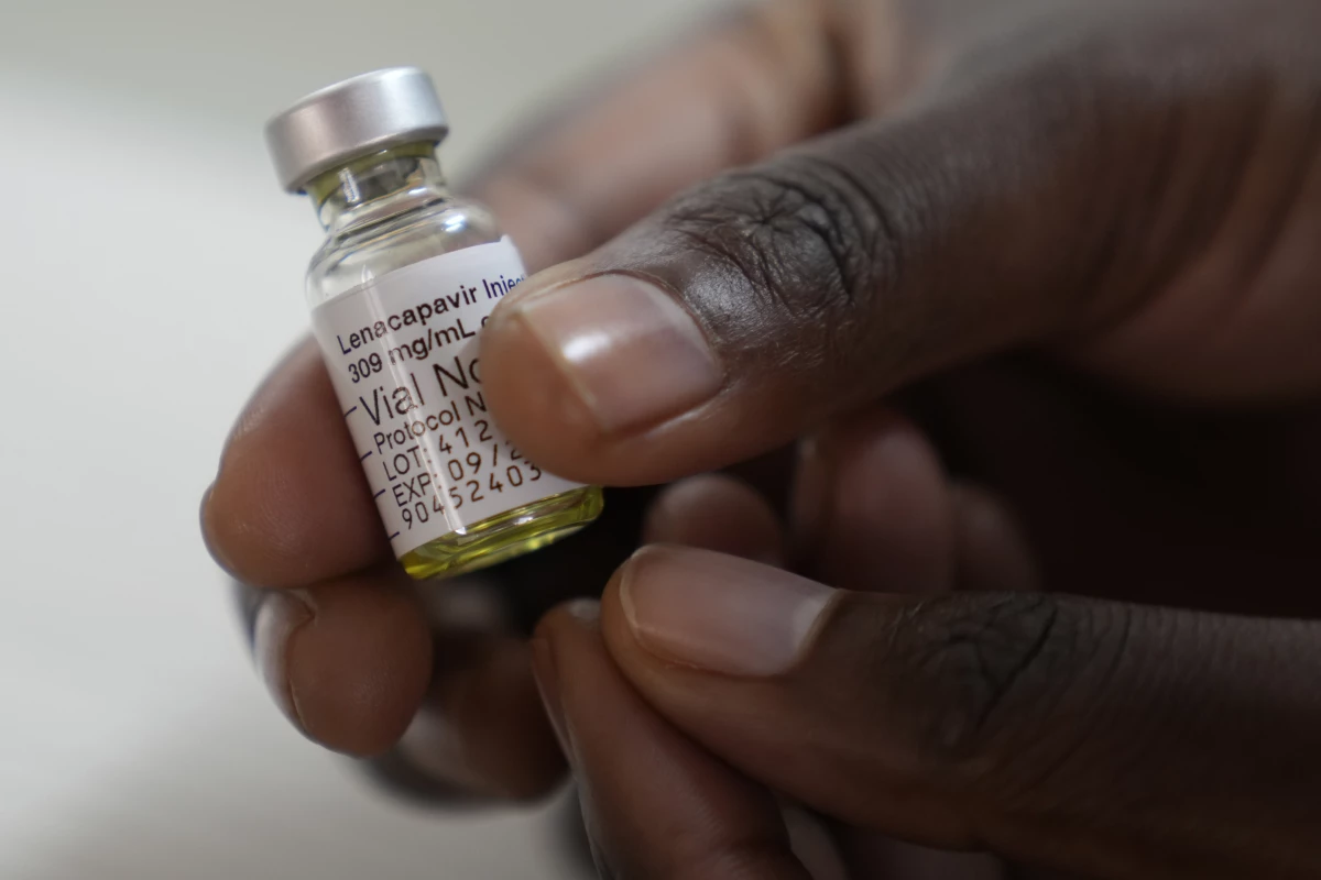 A pharmacist holds a vial of lenacapavir, at the Desmond Tutu Health Foundation's Masiphumelele Research Site, in Cape Town, South Africa. The drug's development has been heralded as the 2024 Breakthrough of the Year by the journal Science, which described it as representing 'a pivotal step toward diminishing HIV/AIDS as a global health crisis.'