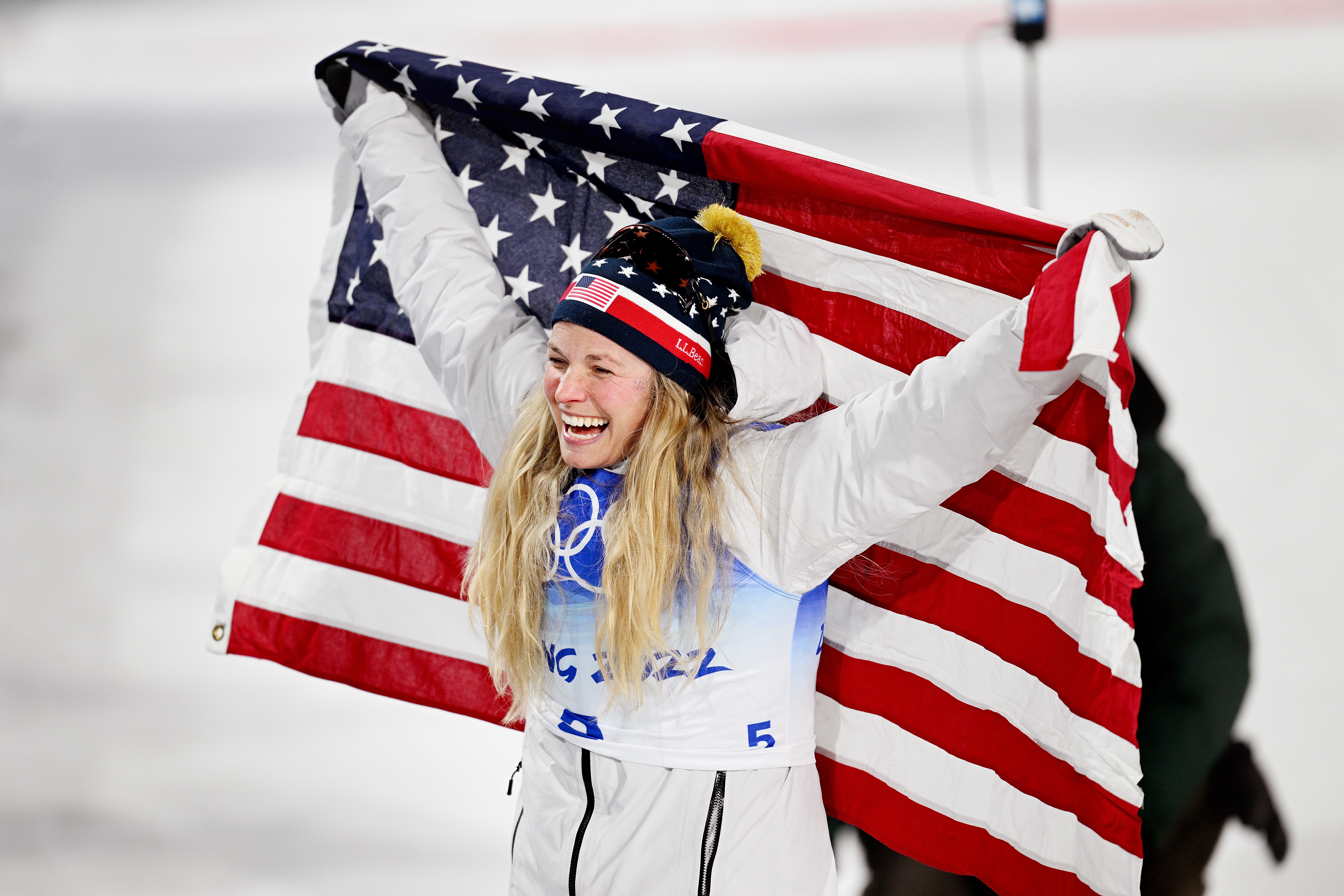 Cross-Country skier Jessie Diggins of Afton, Minnesota celebrates with a flag during the Beijing 2022 Winter Olympic Games.