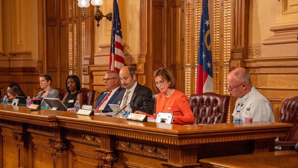 The five-member Georgia State Election Board is comprised of three Republicans, one Democrat and a nonpartisan chair. A new rule the board enacted is causing concern in the swing state. (WABE)