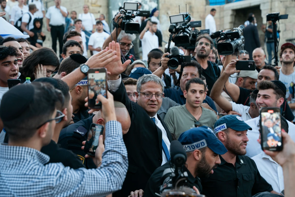 Israel's right-wing national security minister Itamar Ben Gvir waves as tens of thousands of Israelis march through the streets of Jerusalem on Wednesday.