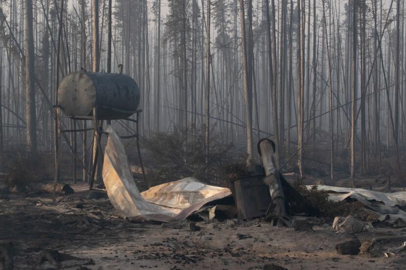 A charred oil tank left over from a house that burned in the Mukluk Fire.