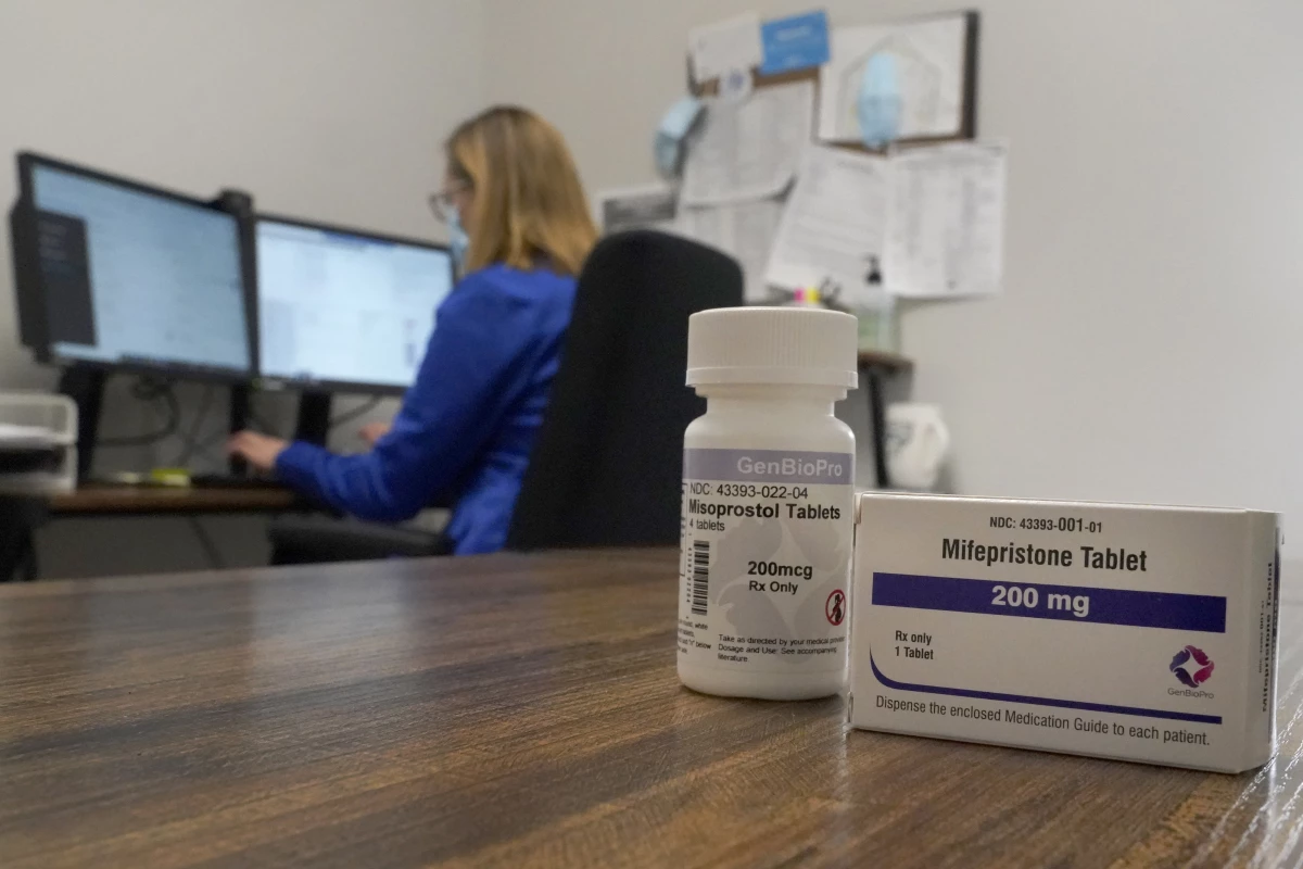 A nurse practitioner works at a Planned Parenthood clinic in Fairview Heights, Ill., where she confers via teleconference with patients seeking medication abortions on Oct. 29, 2021. The two medications used in the process are mifepristone and misoprostol.