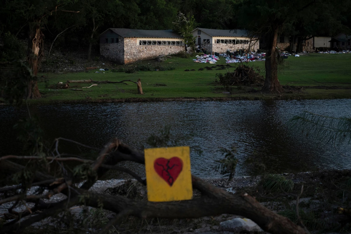 A broken heart sign is displayed near Camp Mystic on July 8 after a flash flood swept through the area in Hunt, Texas.