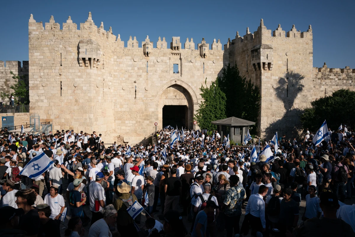 Israeli marchers dance at Damascus Gate, the entrance to the Muslim Quarter of the Old City. Tens of thousands of Israelis marched through the streets of Jerusalem Wednesday for Jerusalem Day.