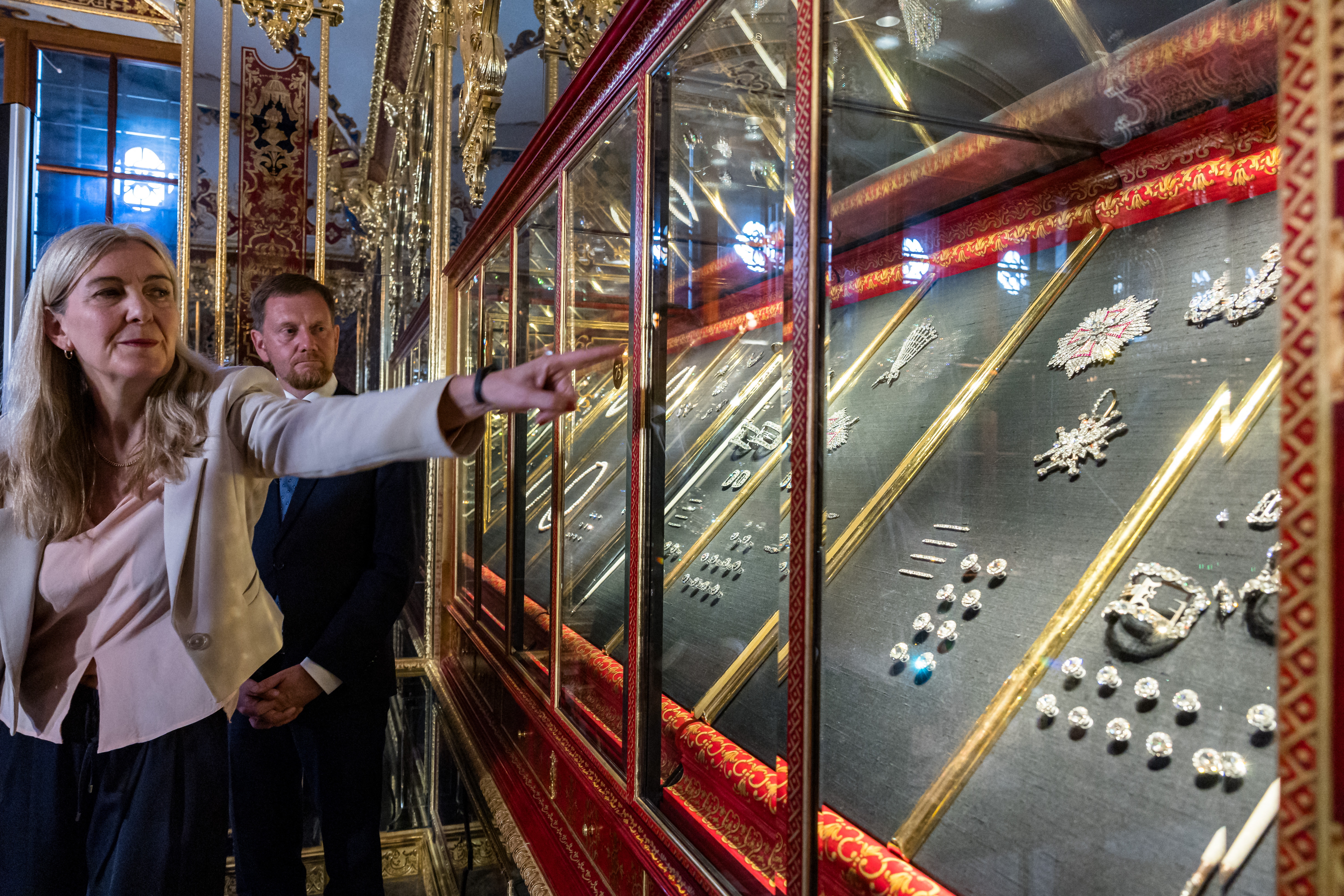 Marion Ackermann, director general of the Dresden State Art Collections, points to a display case with some of the recovered jewelry during a press event at the Green Vault in Dresden, Germany, on Tuesday.