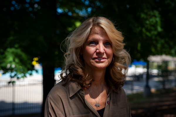 Kerry Webster, a voter who says she voted for Trump in 2020 but isn't sure she will again in 2024, poses for a photo at the Wills Park Pool in Alpharetta, Ga.