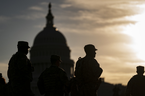 In an encrypted group chat, National Guard members question Trump deployments