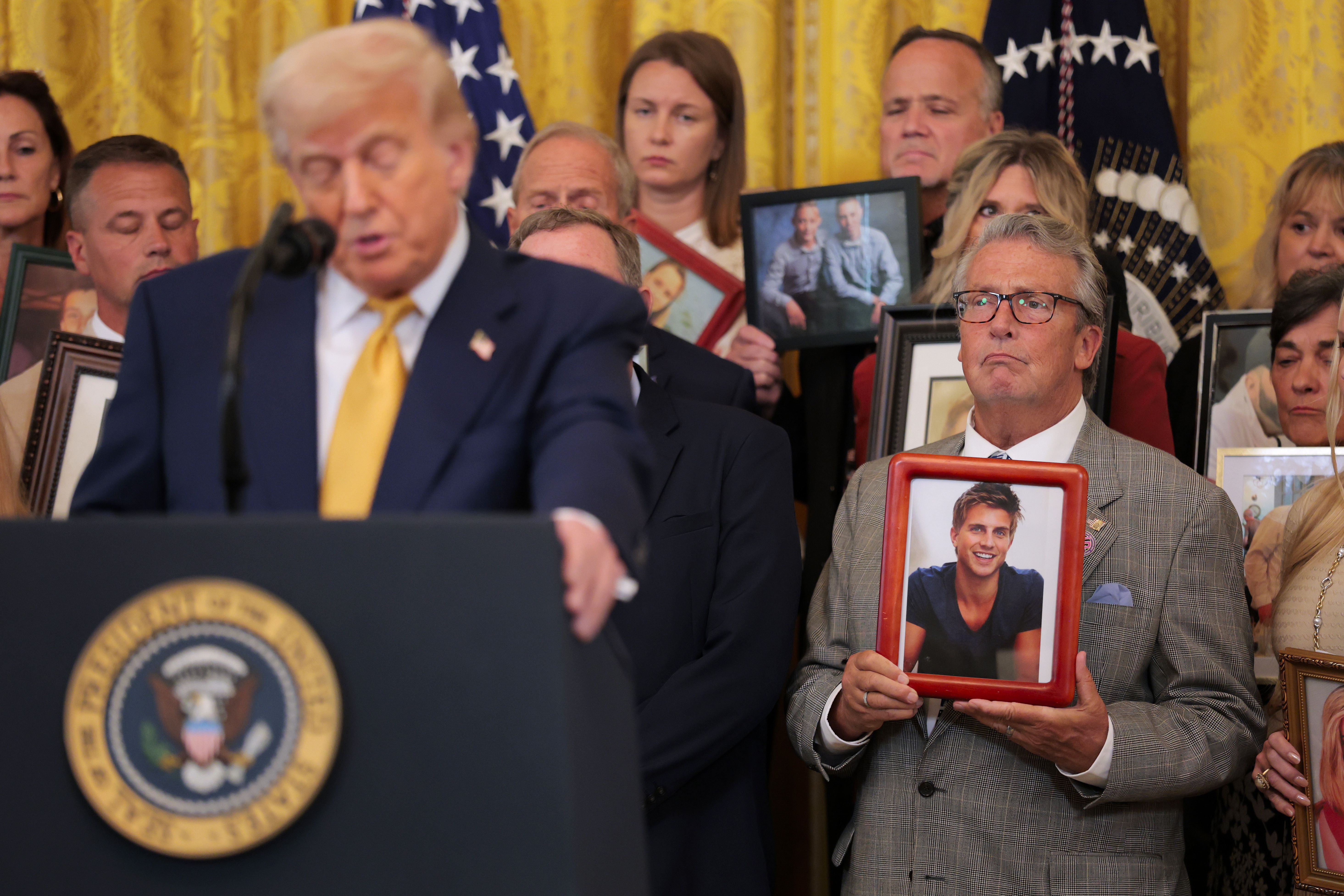 Greg Swan, whose son Drew died as a result of a fentanyl-related substance, looks on as President Trump speaks in the East Room of the White House. The president signed the HALT Fentanyl Act, which aims to permanently classify all fentanyl-related substances as schedule I controlled substances and aid law enforcement in prosecuting trafficking and manufacturing offenses.