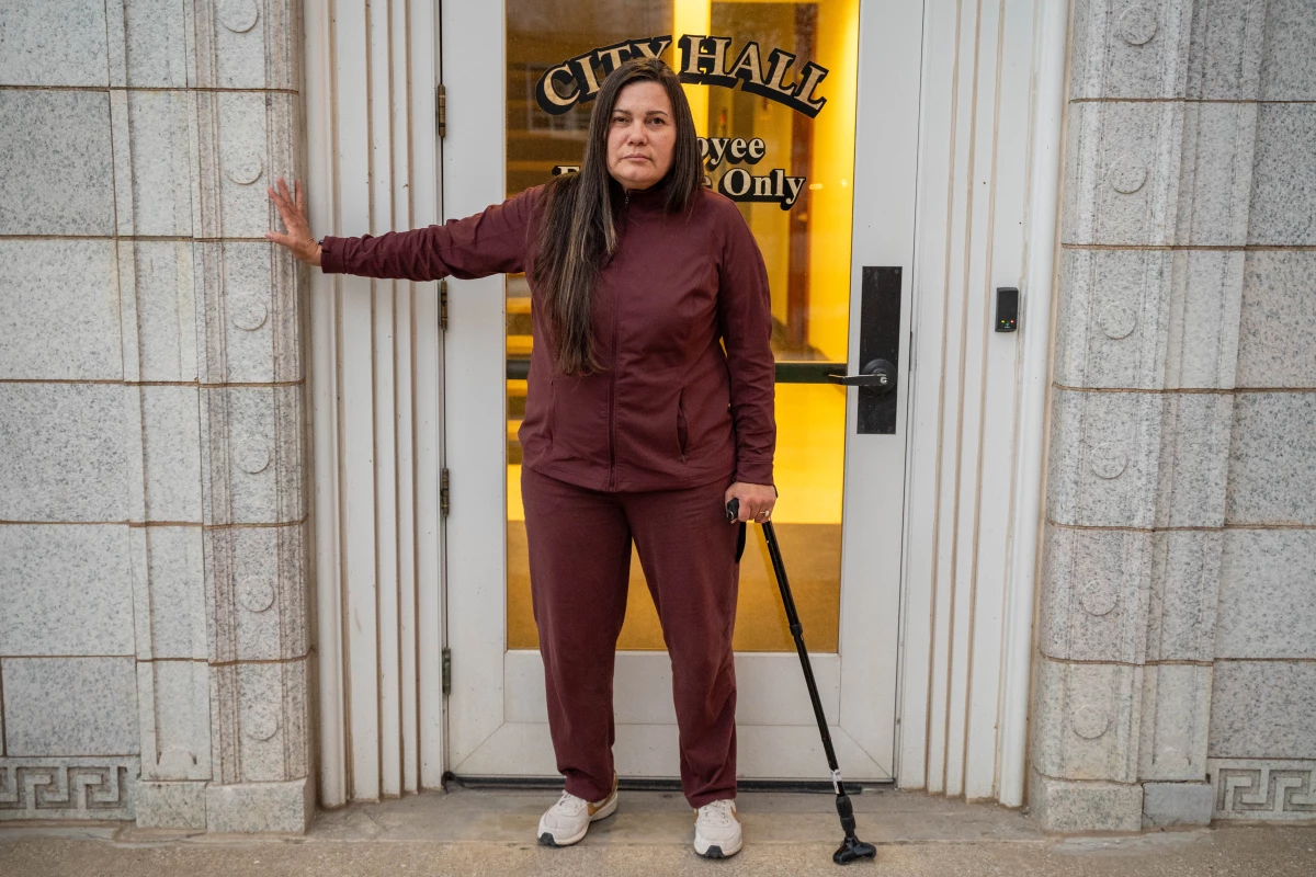 Marcia Levering, a veteran and former CoreCivic employee who suffered debilitating injuries in an attack at the Leavenworth facility, drove three hours from Nebraska to protest the prison's reopening as an immigration detention center.