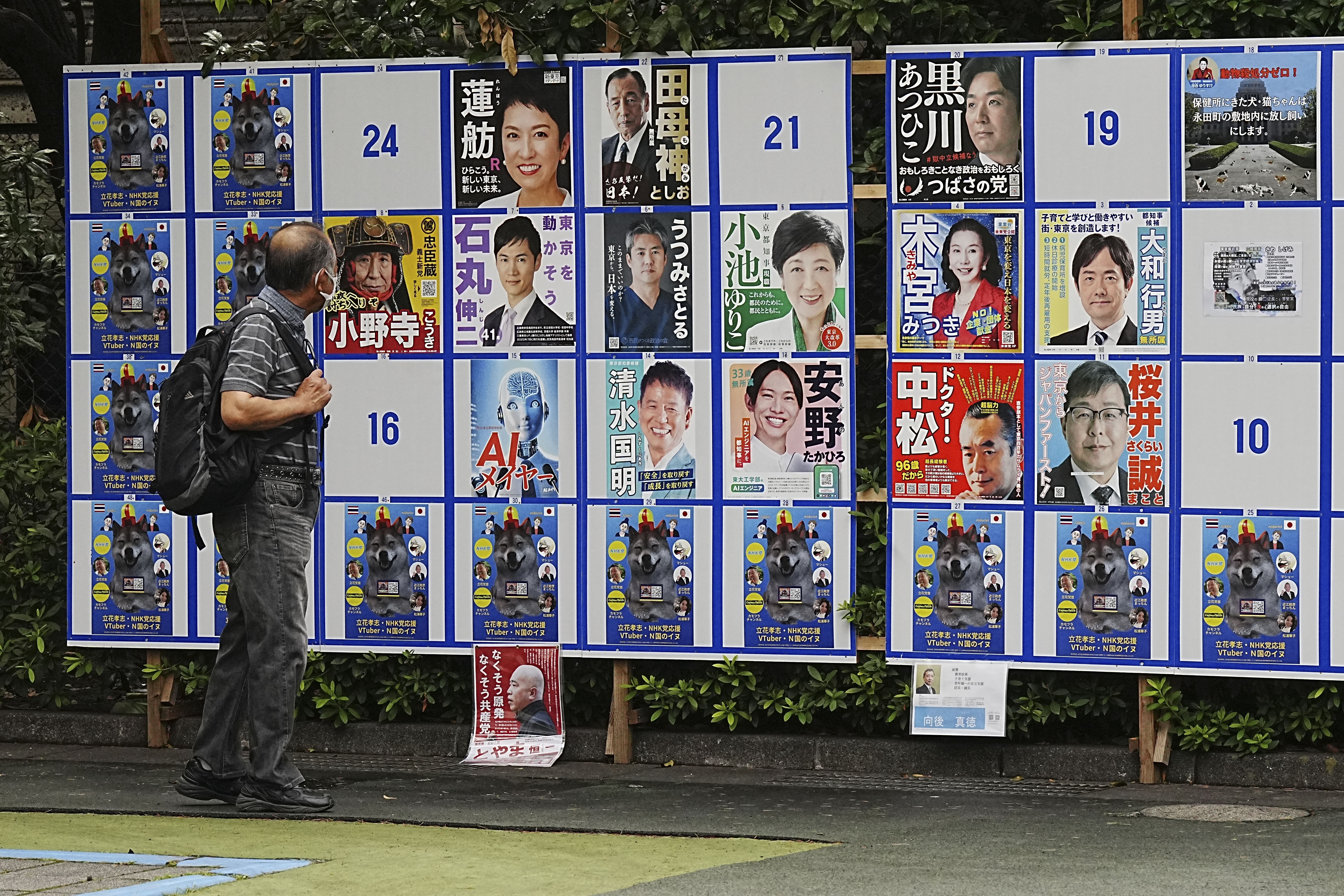 With suggestive poses and pets, ’wacky’ election campaigning tests Tokyo’s patience