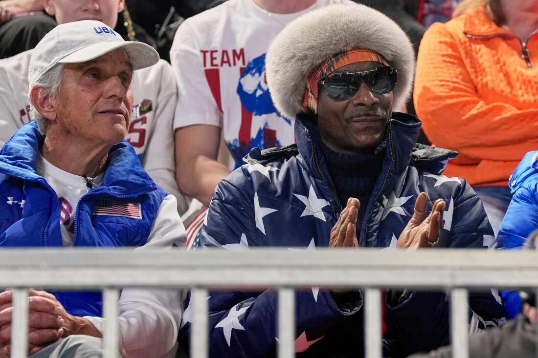 Snoop dog and five-time olympic gold medallist former speed skater Eric Heiden of the U.S. watch the men's 1,000 meters speedskating race at the 2026 Winter Olympics, in Milan, Italy, Wednesday, Feb. 11, 2026.