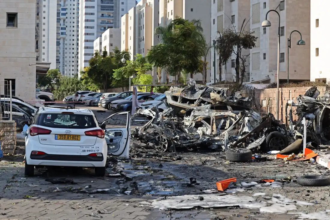 Burnt out vehicles in Ashkelon are pictured following a rocket attack from the Gaza Strip into Israel on October 7, 2023. Barrages of rockets were fired at Israel from the blockaded Gaza Strip at dawn as militants from the Palestinian enclave infiltrated Israel, with at least one person killed, the army and medics said.