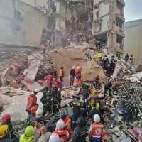 First responders and residents gather at the site of an Israeli airstrike in Beirut's Tallet al-Khayyat neighborhood, on Wednesday.