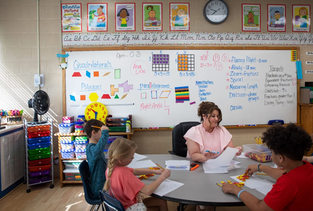 Math teacher Diane Laney hard at work in her third-grade classroom at Ider High school, which serves grades K-12. Students use counters to help model multiplication.