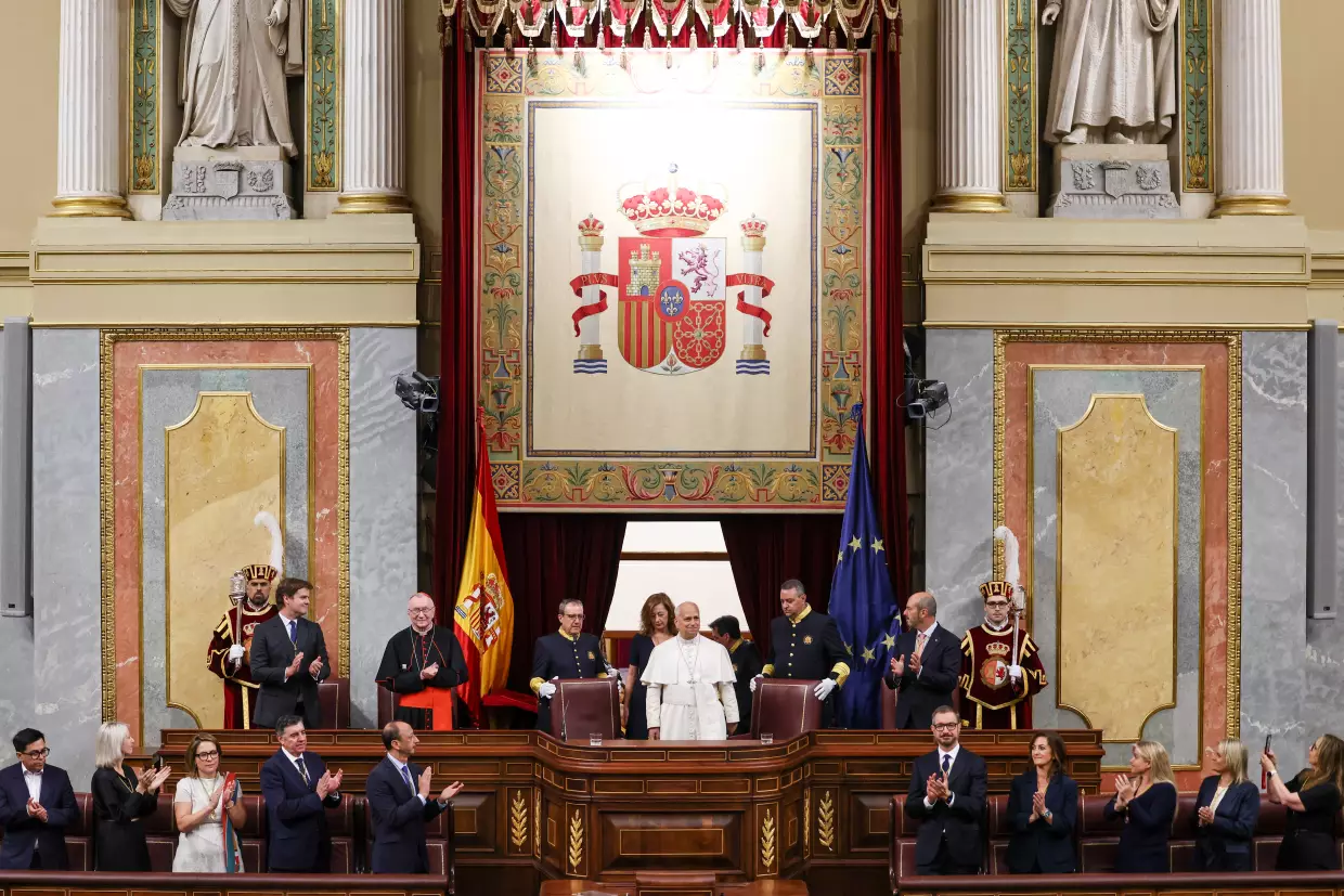 Pope Leo XIV is flanked by Francina Armengol, President of the Congress of Deputies of Spain, as he arrives to meet with members of the Spanish Parliament at the Congress of Deputies, in Madrid, Monday, June 8, 2026.