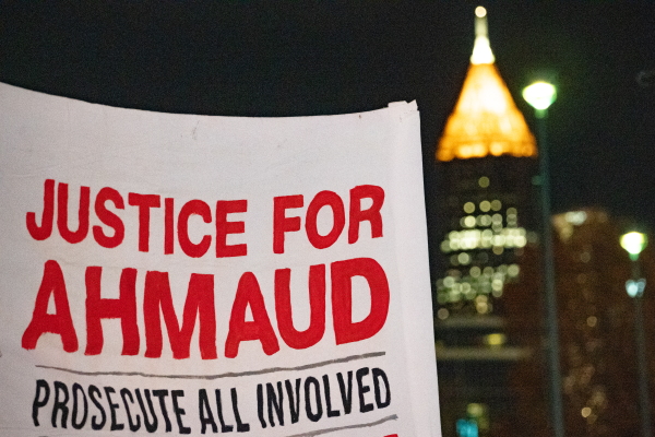 People participate in a demonstration in Atlanta following the guilty verdicts in the trial of the killers of Ahmaud Arbery on Nov. 24, 2021. Greg McMichael, his son Travis McMichael, and a neighbor, William "Roddie" Bryan were found guilty in the February 2020 fatal shooting of 25-year-old Ahmaud Arbery in Brunswick, Ga.