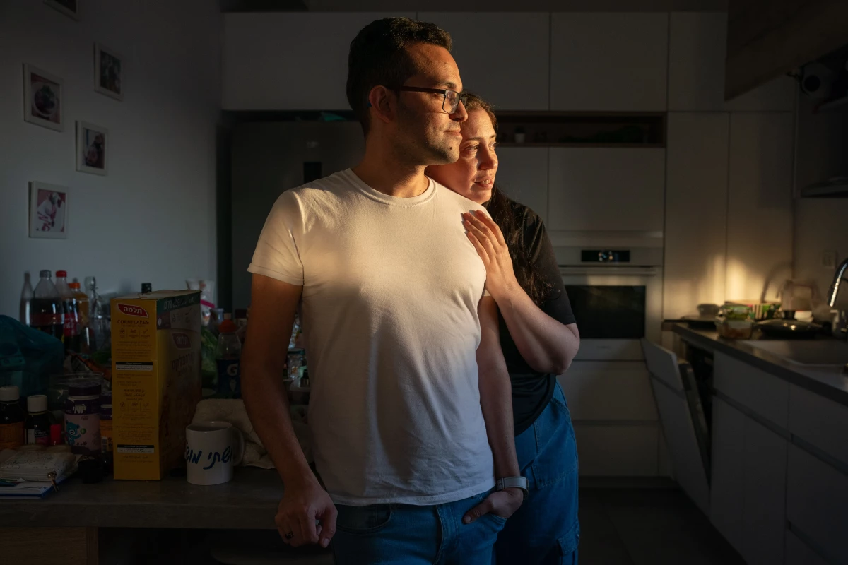 Shlomy Green, 37, and wife Inbal Green, 40, pack their home in Rishon Letsiyon, Israel, on July 11. The couple decided to leave Israel with their four-year-old daughter Riley and move to Thailand.