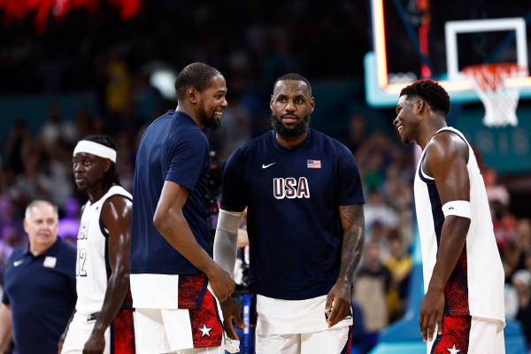 From left, USA's Kevin Durant, LeBron James and Anthony Edwards are seen after winning a group game against South Sudan during the Paris Olympic Games in Villeneuve-d'Ascq, northern France, on July 31.