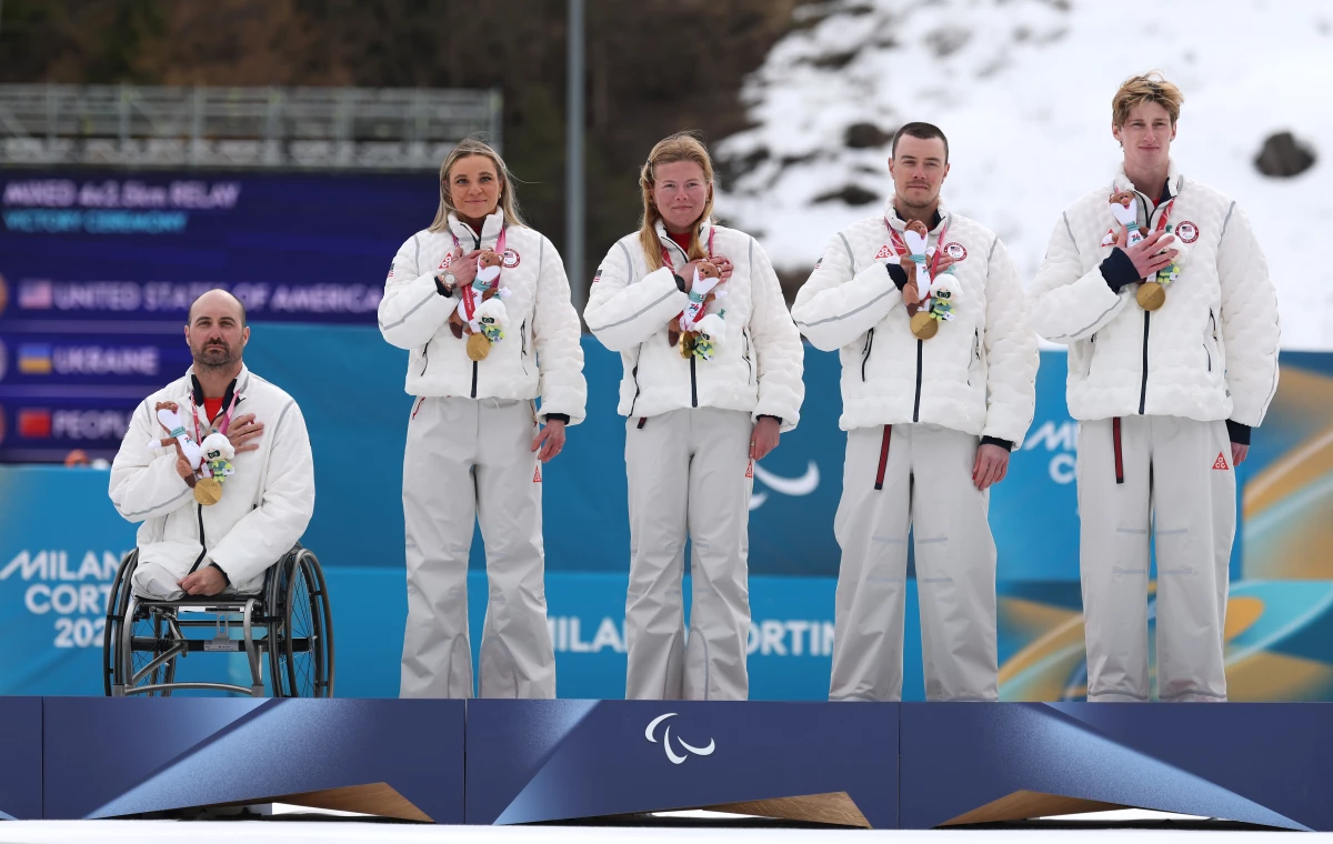 Joshua Sweeney, Oksana Masters, Sydney Peterson, Jake Adicoff and his guide Reid Goble of Team USA participate in the medal ceremony after the para cross-country skiing mixed 4x2.5km relay.