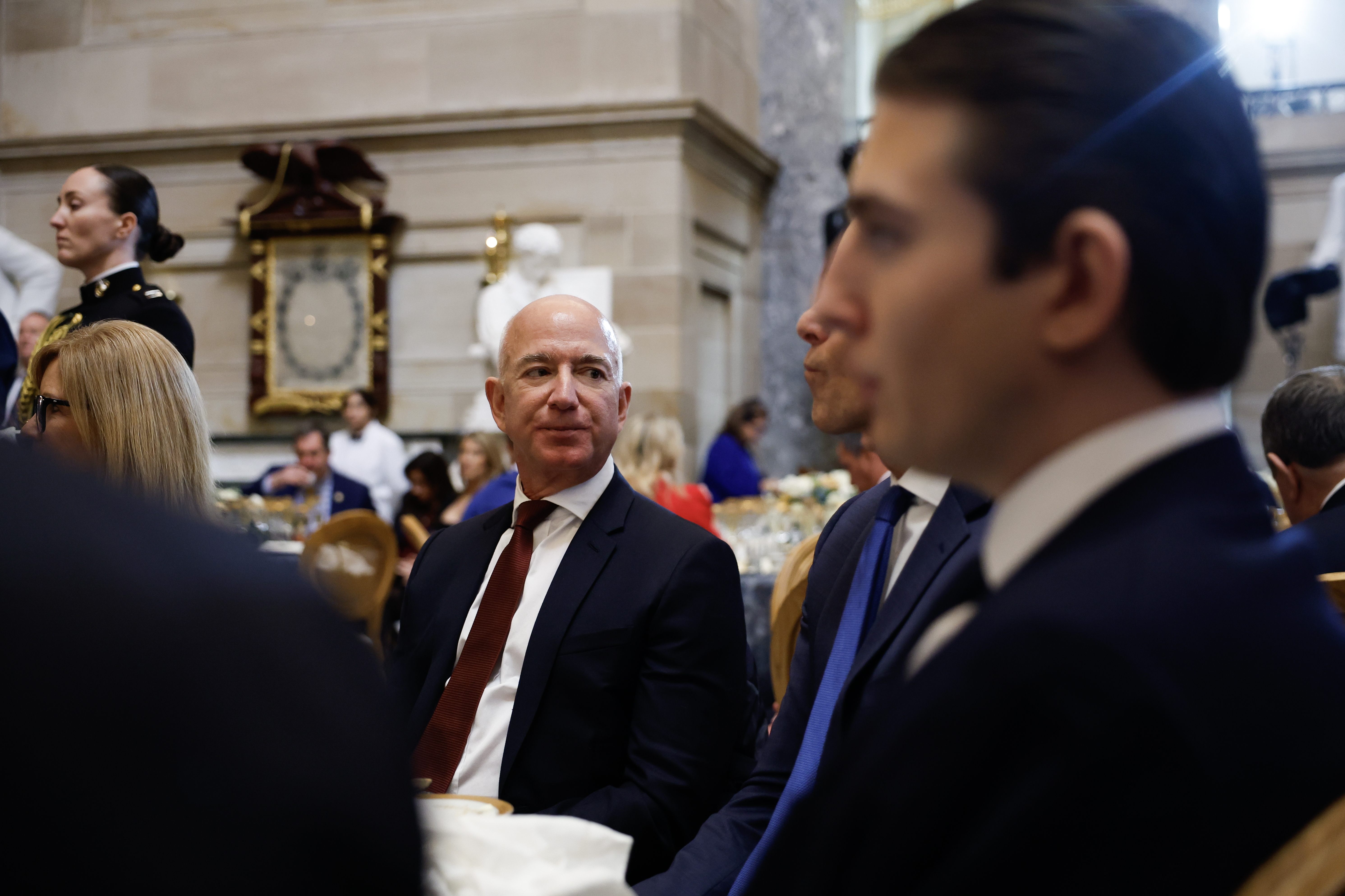 <em>The Washington Post</em> owner Jeff Bezos attends a luncheon following the inauguration of President Trump in January. Bezos says the newspaper