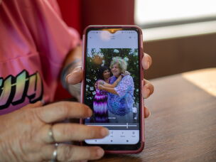 Tara Gentner pulls up a picture with her mother, Sheri Petty. Gentner lived with her mother last summer when their air conditioners and swamp cooler broke. Petty died from the subsequent heat exposure.