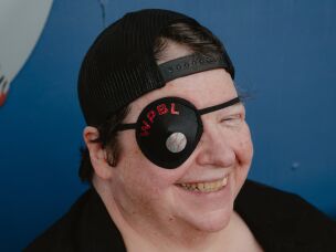 Rebecca Buchanan, of Springfield, Ill., dons a custom eye patch at a WPBL game at Robin Roberts Stadium on Sunday, Aug. 2.